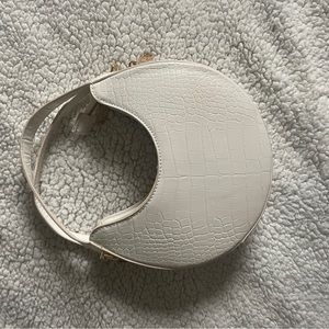 circular white croc bag
